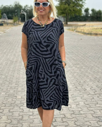 Nelia™ - Summer dress with a round neck and a beautiful print 