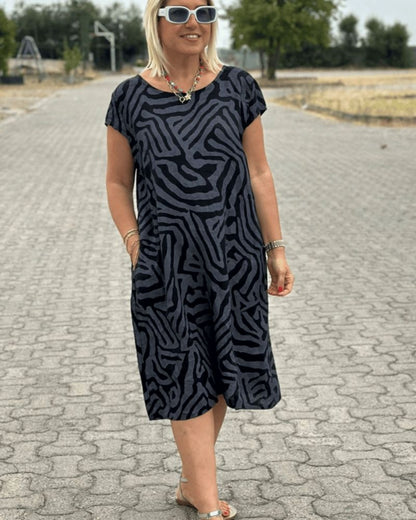 Nelia™ - Summer dress with a round neck and a beautiful print 